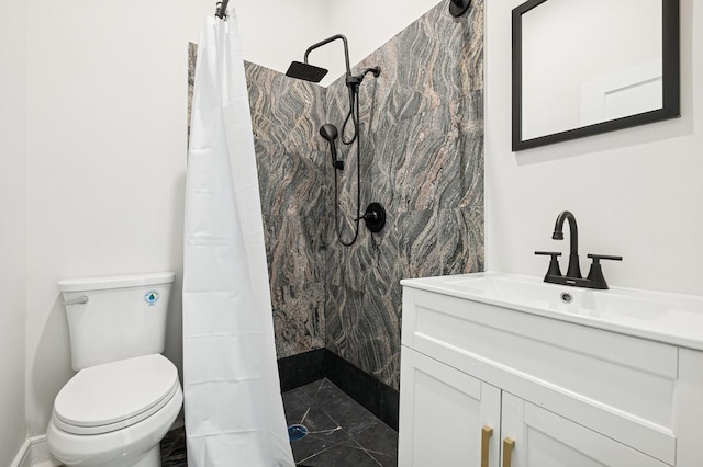 bathroom featuring vanity, a shower with shower curtain, and toilet