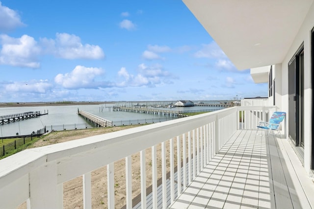 balcony featuring a water view