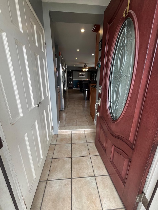interior space featuring recessed lighting, a ceiling fan, and light tile patterned flooring