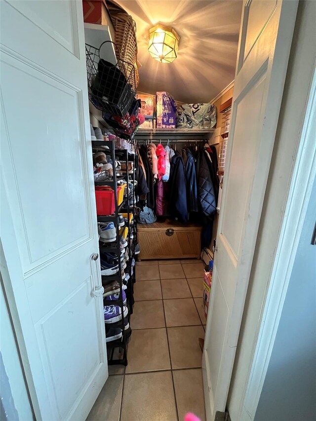 spacious closet with tile patterned floors