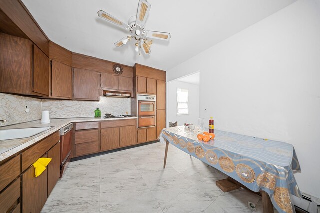 172-11 Horace Hadring Expy, Flushing, NY 11365 - kitchen featuring decorative backsplash, white oven, a sink, light countertops, and a warming drawer