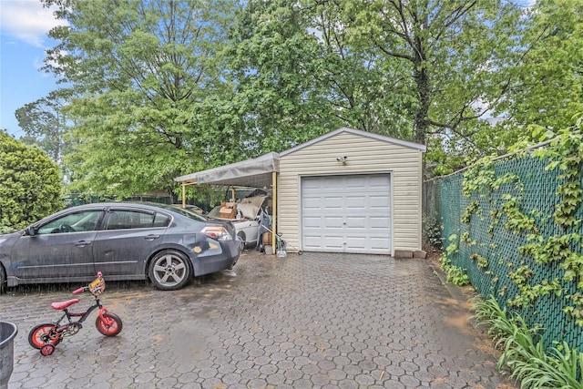 garage with fence