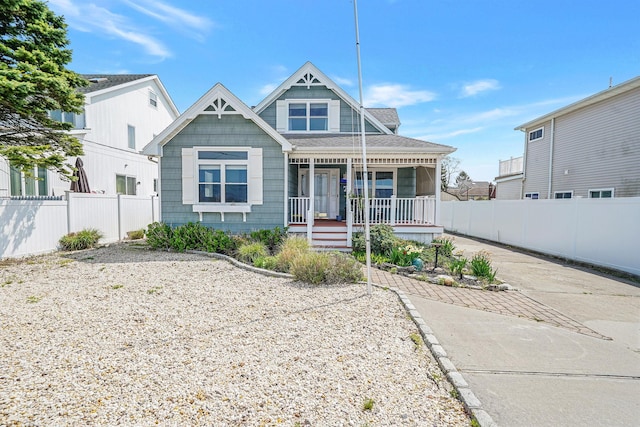 7 Grandview Dr, Shirley, NY 11967 - view of front facade featuring covered porch and fence