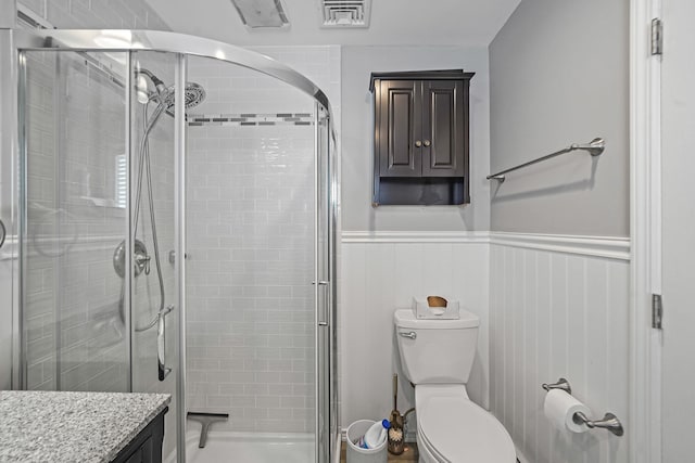 7 Grandview Dr, Shirley, NY 11967 - bathroom with vanity, a stall shower, toilet, and a wainscoted wall
