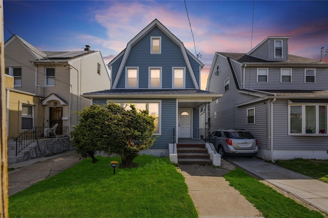 186-09 Dormans Rd, Saint Albans, NY 11412 - dutch colonial with a gambrel roof and a front yard