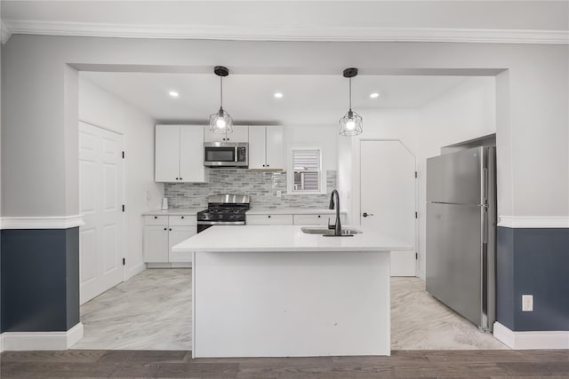 186-09 Dormans Rd, Saint Albans, NY 11412 - kitchen with baseboards, light countertops, white cabinetry, a sink, and stainless steel appliances