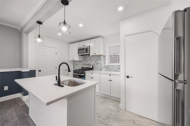 186-09 Dormans Rd, Saint Albans, NY 11412 - kitchen with white cabinets, stainless steel appliances, a center island with sink, and a sink