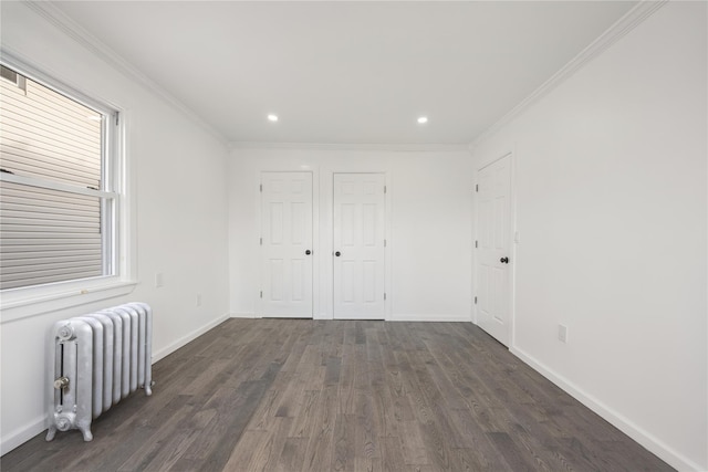 186-09 Dormans Rd, Saint Albans, NY 11412 - unfurnished bedroom featuring baseboards, recessed lighting, dark wood-style flooring, and radiator heating unit