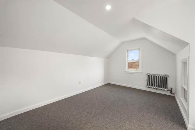 186-09 Dormans Rd, Saint Albans, NY 11412 - bonus room with radiator, dark colored carpet, recessed lighting, baseboards, and lofted ceiling