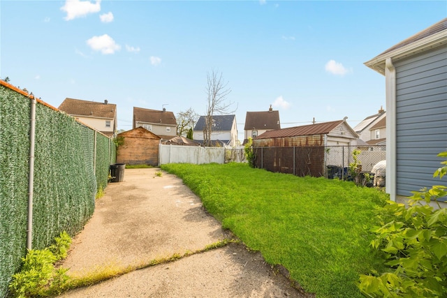 186-09 Dormans Rd, Saint Albans, NY 11412 - view of yard with a residential view and a fenced backyard