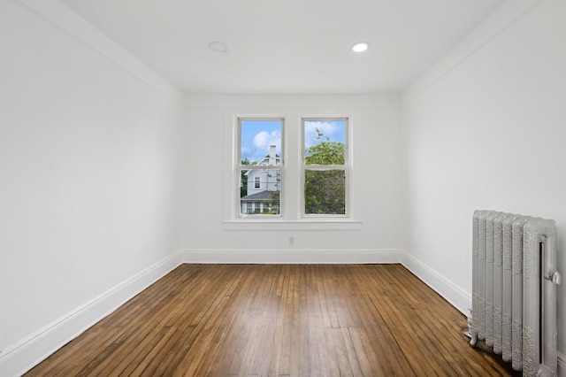 31-50 Buell, East Elmhurst, NY 11369 - empty room with radiator heating unit, baseboards, and hardwood / wood-style flooring