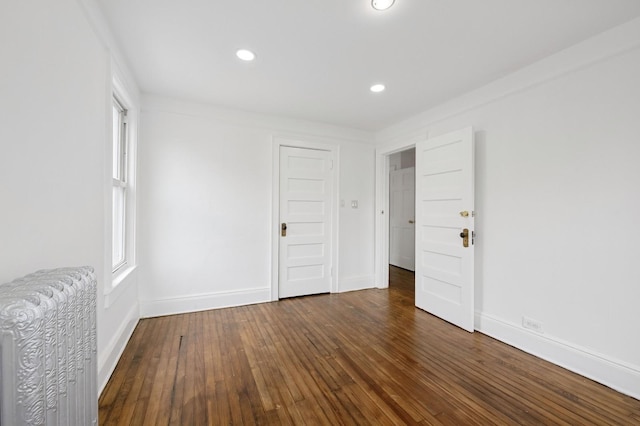 31-50 Buell, East Elmhurst, NY 11369 - unfurnished bedroom featuring radiator heating unit, hardwood / wood-style flooring, baseboards, and recessed lighting