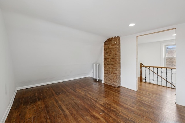 31-50 Buell, East Elmhurst, NY 11369 - spare room featuring radiator heating unit, wood finished floors, baseboards, vaulted ceiling, and recessed lighting