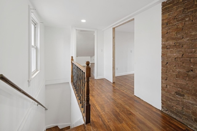 31-50 Buell, East Elmhurst, NY 11369 - hallway with an upstairs landing, brick wall, wood finished floors, and recessed lighting