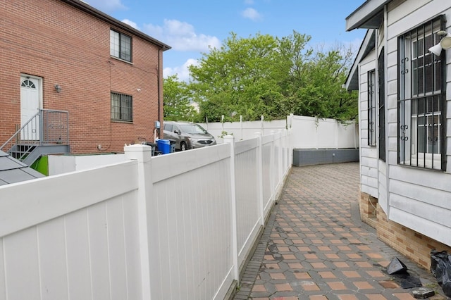 31-50 Buell, East Elmhurst, NY 11369 - view of side of property with a fenced backyard and a patio area