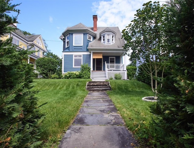 80 Clifton Ave, Kingston, NY 12401 - victorian house featuring a porch, a chimney, and a front yard