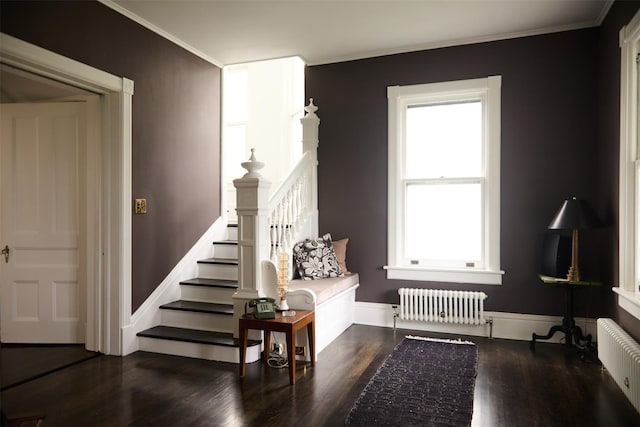 80 Clifton Ave, Kingston, NY 12401 - living area featuring radiator, wood finished floors, ornamental molding, and stairway