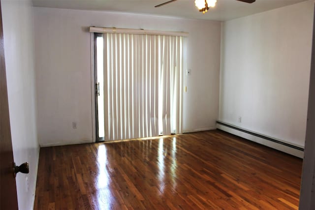 unfurnished room with ceiling fan, baseboard heating, and wood finished floors