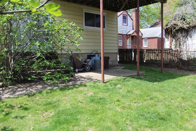 view of yard featuring a patio area and fence