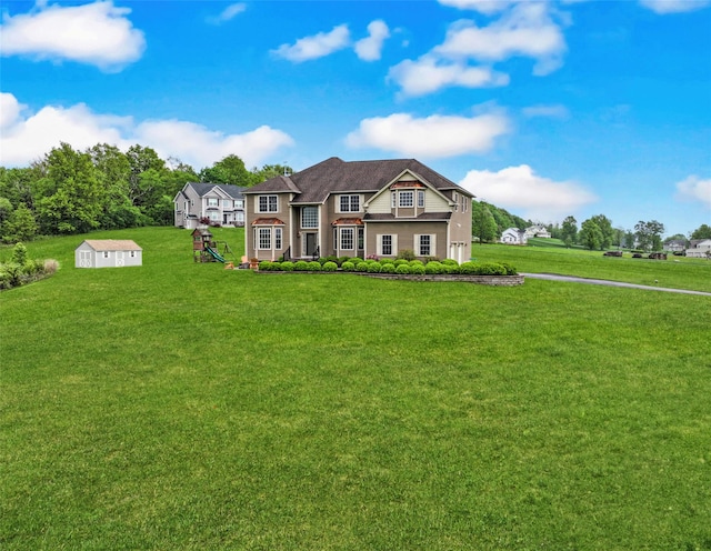 54 Fox Hill Run, Rock Tavern, NY 12575 - view of front of property with a front lawn, an outdoor structure, and a storage shed