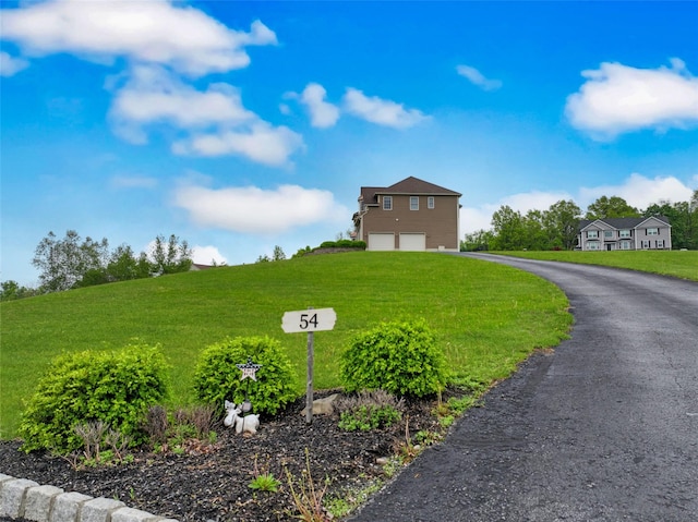54 Fox Hill Run, Rock Tavern, NY 12575 - view of front of house with a garage, driveway, and a front yard