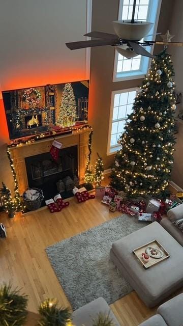 54 Fox Hill Run, Rock Tavern, NY 12575 - living room with a fireplace, wood finished floors, and a towering ceiling