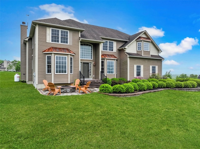 54 Fox Hill Run, Rock Tavern, NY 12575 - rear view of property with an outdoor fire pit, a yard, a chimney, and a shingled roof