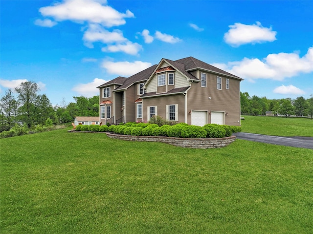 54 Fox Hill Run, Rock Tavern, NY 12575 - view of front of property with asphalt driveway, an attached garage, and a front lawn