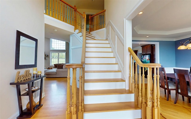 54 Fox Hill Run, Rock Tavern, NY 12575 - staircase featuring crown molding, wood finished floors, recessed lighting, a chandelier, and baseboards
