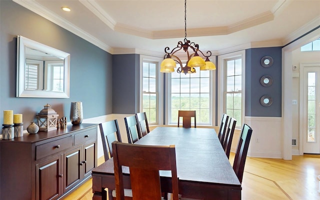 54 Fox Hill Run, Rock Tavern, NY 12575 - dining room featuring a chandelier, light wood-style flooring, a raised ceiling, and crown molding