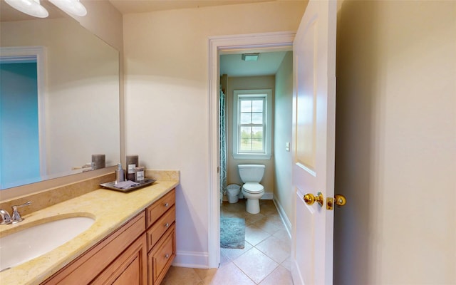 54 Fox Hill Run, Rock Tavern, NY 12575 - full bathroom with toilet, tile patterned floors, vanity, baseboards, and curtained shower
