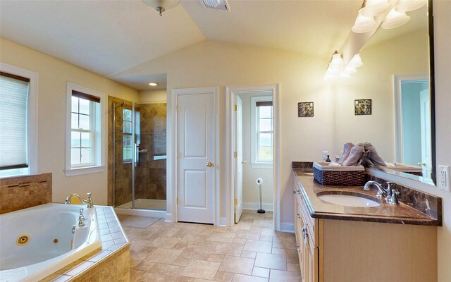 54 Fox Hill Run, Rock Tavern, NY 12575 - bathroom with vaulted ceiling, a shower stall, a jetted tub, vanity, and baseboards