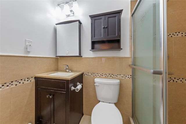 bathroom featuring tile walls, a stall shower, and toilet