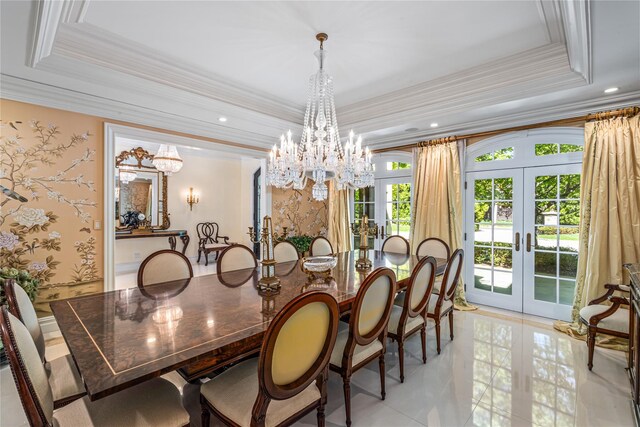 167 Brookville Rd, Brookville, NY 11545 - dining area with french doors, a tray ceiling, a chandelier, crown molding, and light tile patterned floors