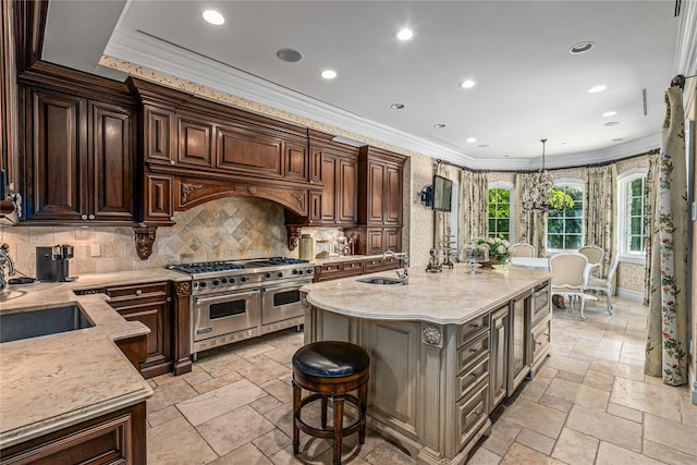 167 Brookville Rd, Brookville, NY 11545 - kitchen with appliances with stainless steel finishes, a sink, stone tile flooring, ornamental molding, and tasteful backsplash