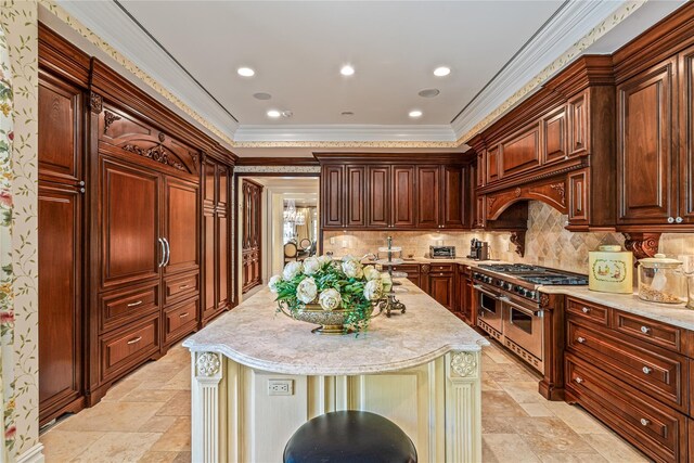 167 Brookville Rd, Brookville, NY 11545 - kitchen featuring double oven range, stone tile floors, a center island with sink, backsplash, and ornamental molding