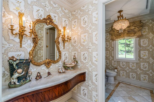 167 Brookville Rd, Brookville, NY 11545 - bathroom featuring crown molding, baseboards, inlaid floor details, toilet, and a chandelier