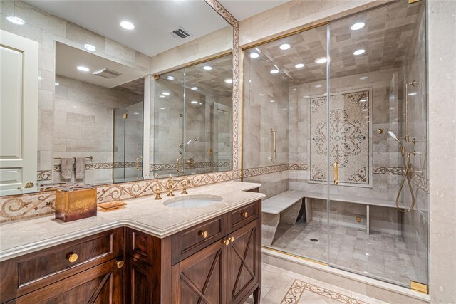 167 Brookville Rd, Brookville, NY 11545 - bathroom featuring vanity, a stall shower, recessed lighting, and tile walls