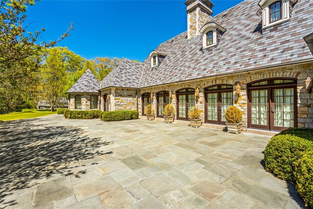 167 Brookville Rd, Brookville, NY 11545 - view of patio featuring french doors
