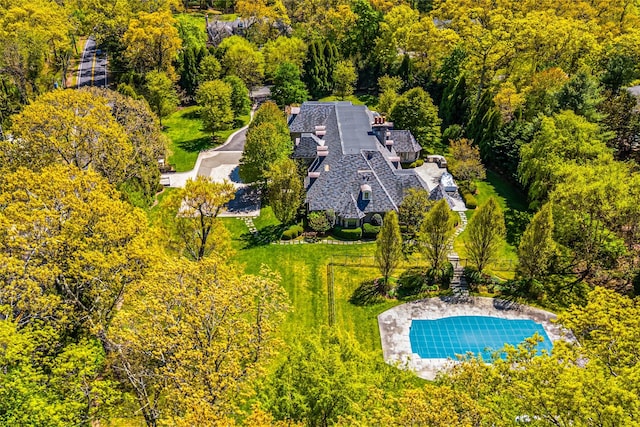 167 Brookville Rd, Brookville, NY 11545 - view of subject property with a pool area and a forest