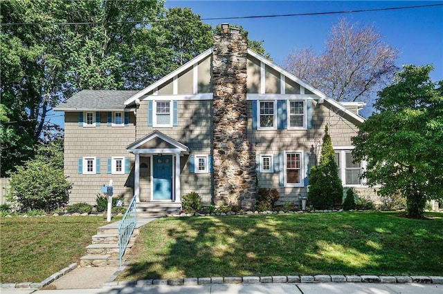 437 Carroll Ave, Mamaroneck, NY 10543 - view of front of home with a front yard and a chimney