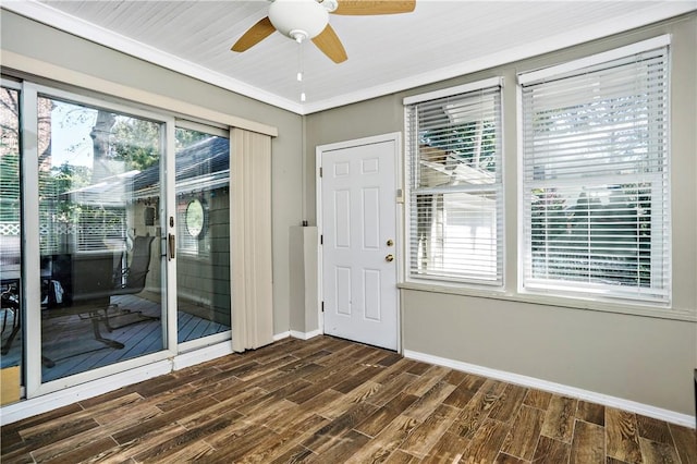 437 Carroll Ave, Mamaroneck, NY 10543 - foyer with ceiling fan, healthy amount of natural light, dark wood-style floors, baseboards, and crown molding