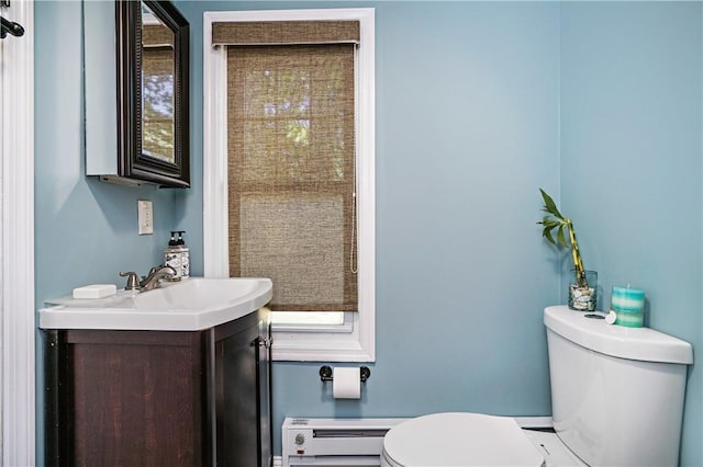 437 Carroll Ave, Mamaroneck, NY 10543 - bathroom featuring toilet, a baseboard radiator, and vanity