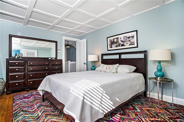 437 Carroll Ave, Mamaroneck, NY 10543 - bedroom with coffered ceiling, baseboards, and wood finished floors