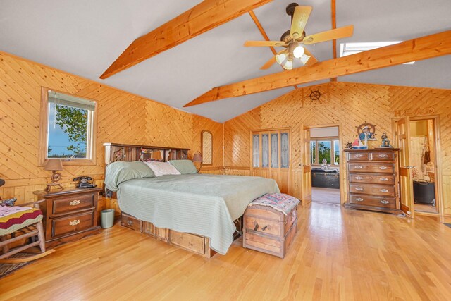 331 Cross Bay Blvd, Broad Channel, NY 11693 - bedroom with wooden walls, multiple windows, and lofted ceiling with beams