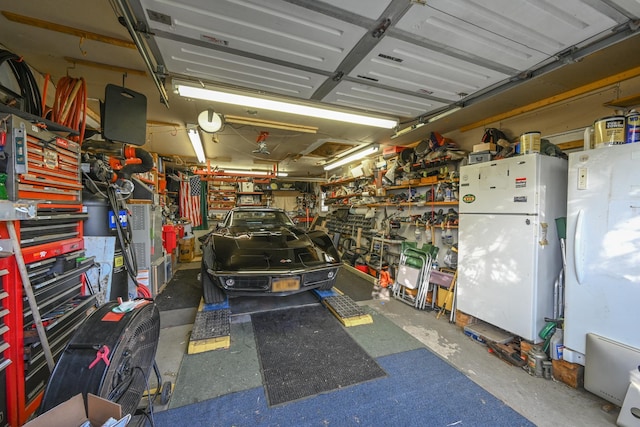 331 Cross Bay Blvd, Broad Channel, NY 11693 - garage featuring a workshop area and freestanding refrigerator