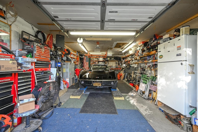 331 Cross Bay Blvd, Broad Channel, NY 11693 - garage featuring a workshop area and freestanding refrigerator