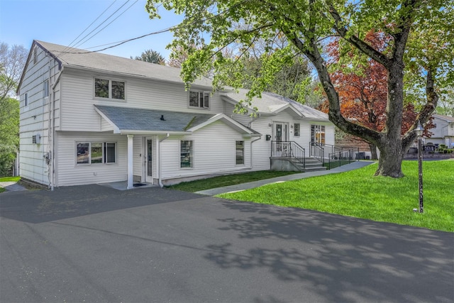 104 W Maple Ave, Monsey, NY 10952 - view of front of property featuring roof with shingles, driveway, and a front yard