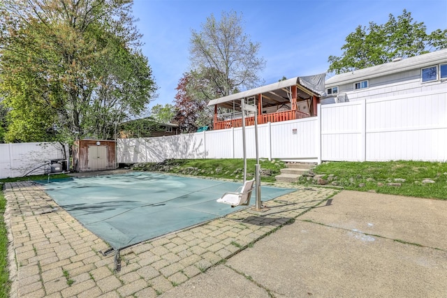 104 W Maple Ave, Monsey, NY 10952 - view of pool featuring a patio, a fenced backyard, an outbuilding, and a storage unit