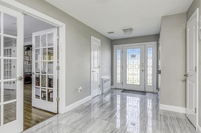 104 W Maple Ave, Monsey, NY 10952 - entrance foyer featuring baseboards, french doors, marble finish floor, and visible vents